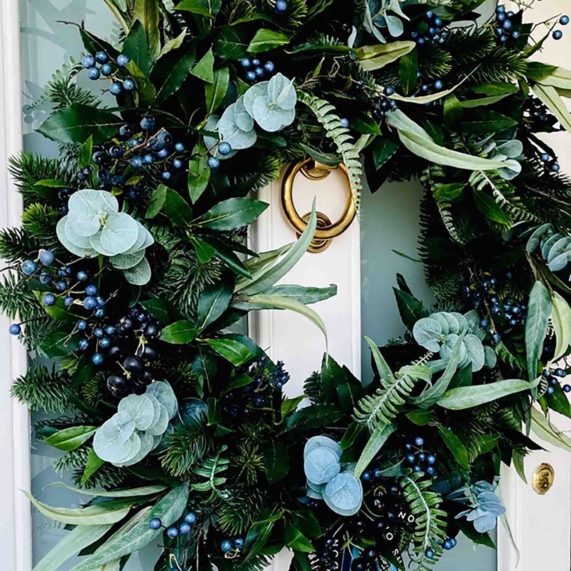 Extra Large Christmas Wreath with Artificial Green Foliage and Blue Berries on Front Door