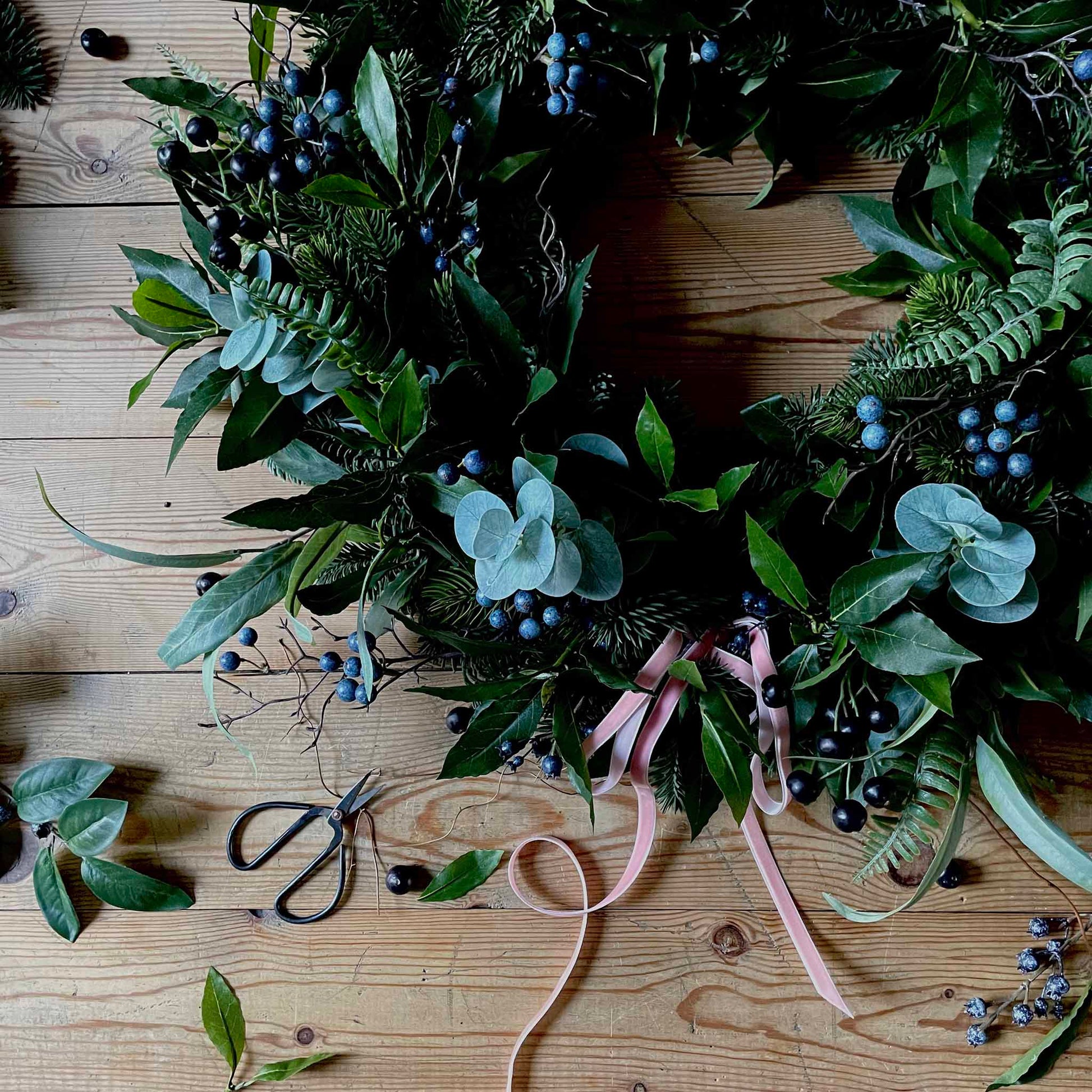 Luxury faux foliage wreath with pink velvet ribbon