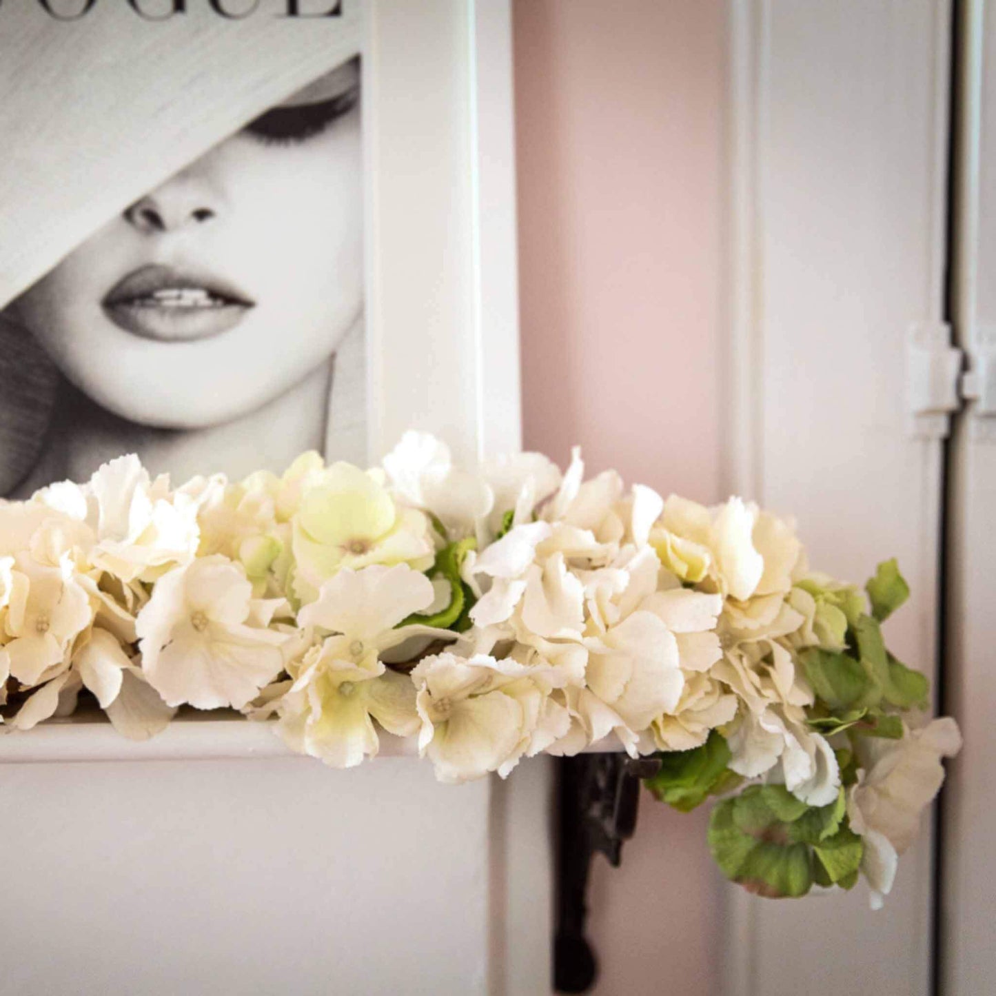 Spring white and green faux hydrangea garland on mantle