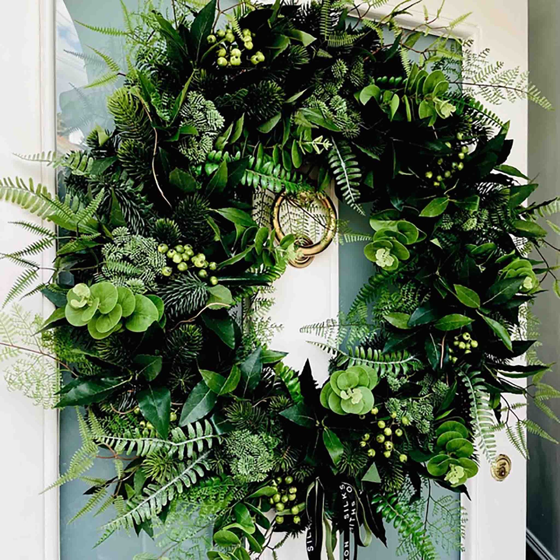 Extra Large Christmas Wreath with Artificial Green Foliage and Green Berries on Front Door