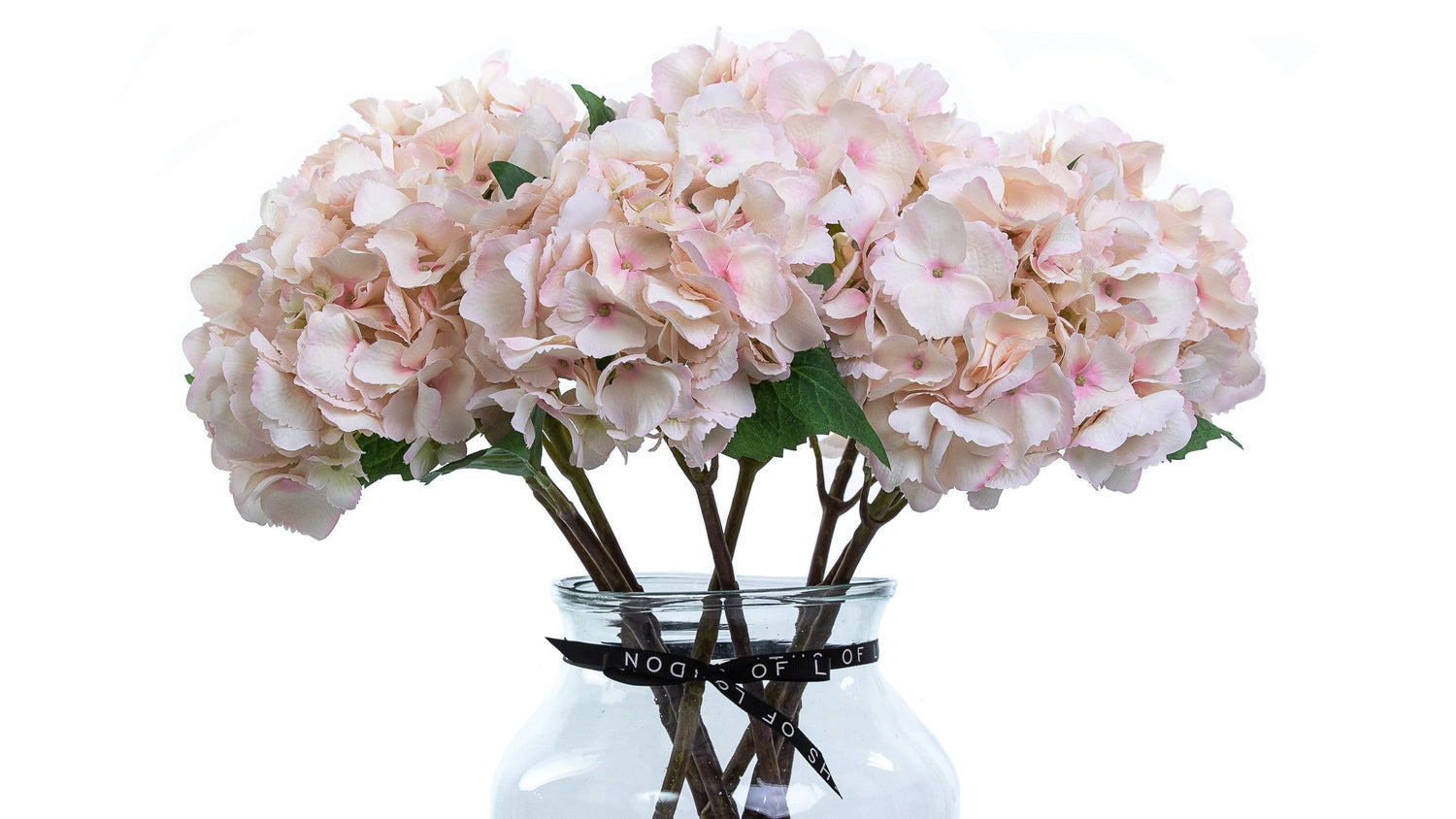 Faux light pink hydrangea bouquet in apothecary vase