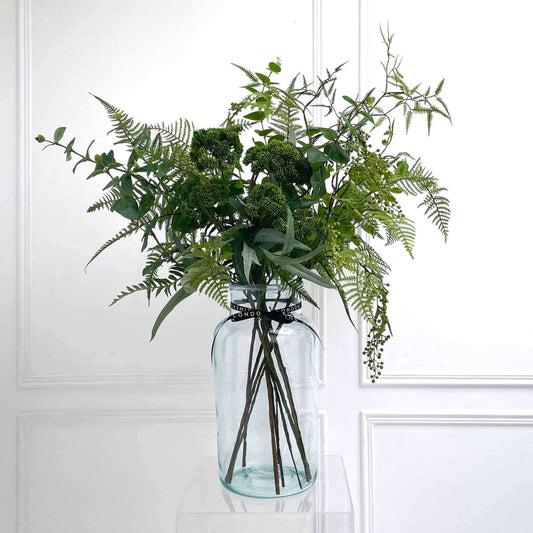 Faux foraged fern bouquet in apothecary vase