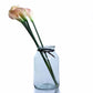 Pale pink faux calla lilies in apothecary vase
