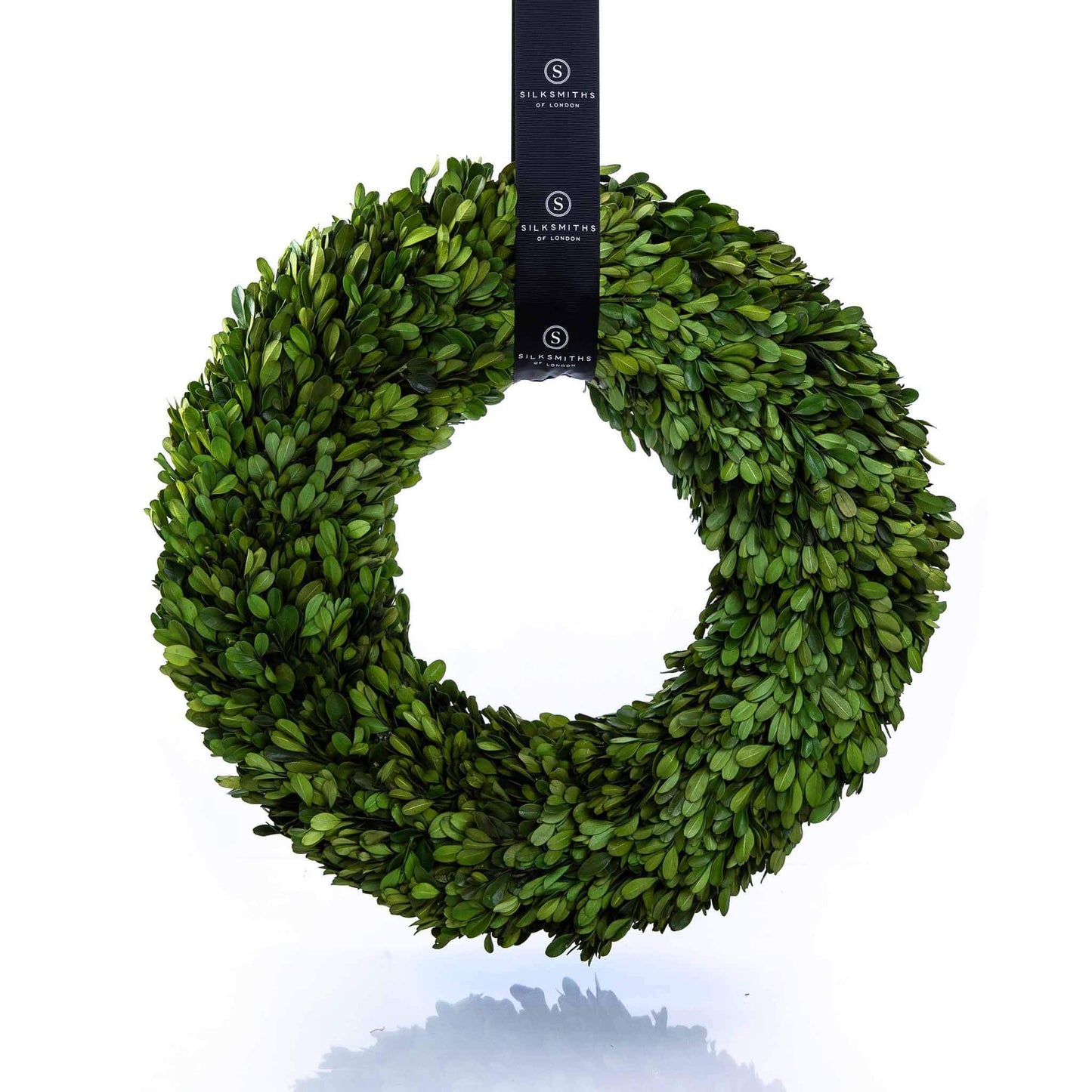 Large preserved boxwood wreath with silksmiths grosgrain sash