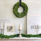 Preserved boxwood wreath and matching sash on mantle