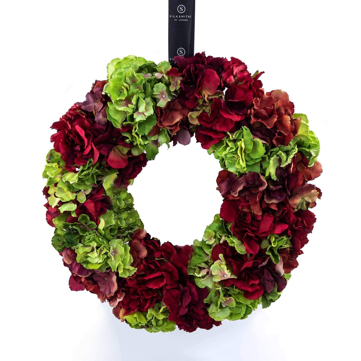 Red and green faux hydrangea wreath with sash